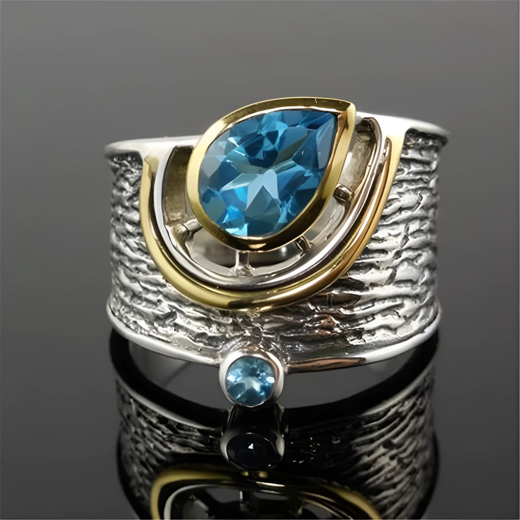 Women's Chinese style drop shape ring with blue rhinestone zircon centrepiece on alloy band