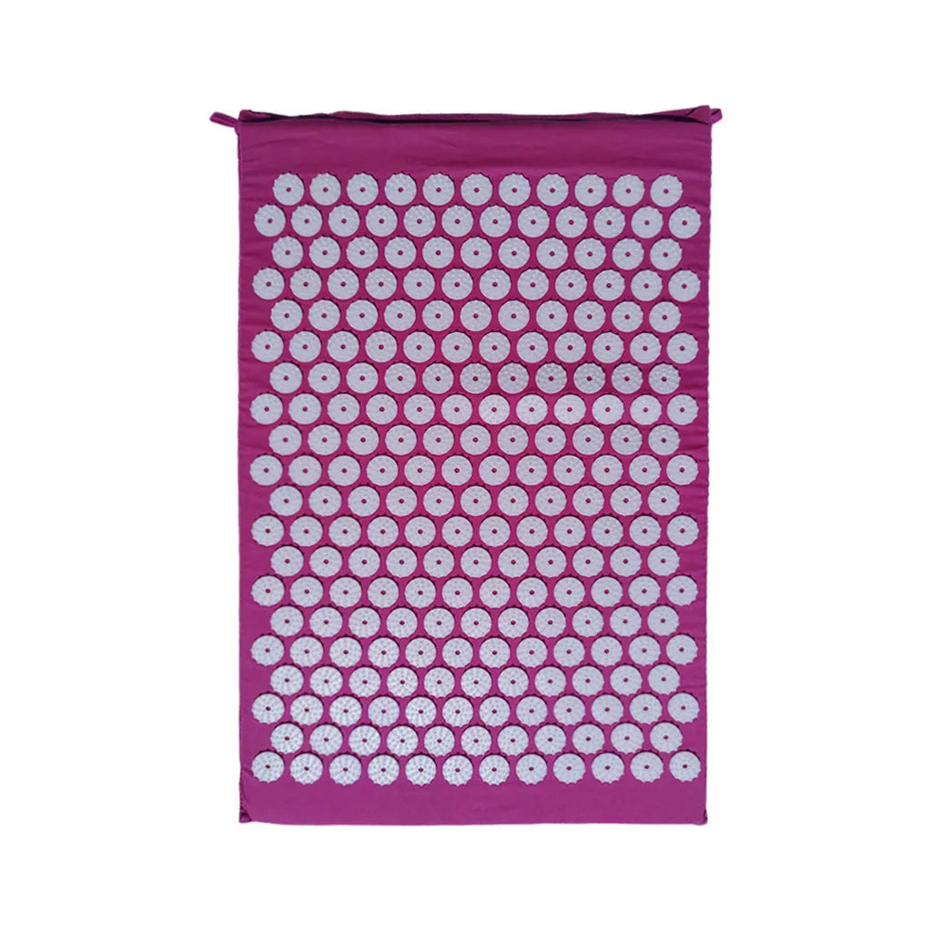 Black and blue acupuncture massage mat with cushion and headrest on floor