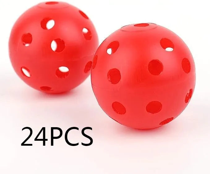 Assorted multi-colour golf practice balls in a net bag on a green surface.