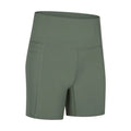 Women's solid colour mid-length sports shorts with a tight fit and waistband.