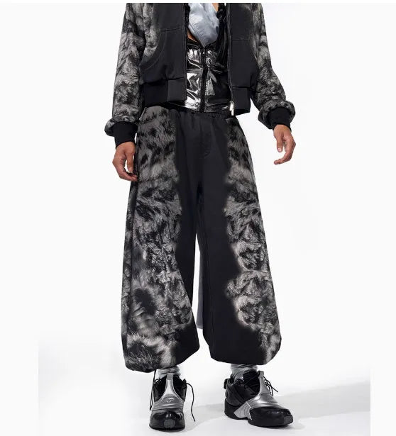 Streetwear co-ord set featuring printed loose trousers, a matching hoodie, and seven-inch shorts on a neutral background.