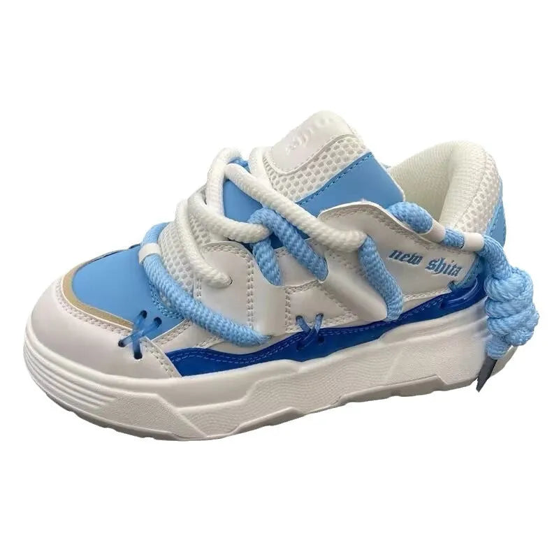 Women's grey chunky platform sneakers with thick soles and lace-up front