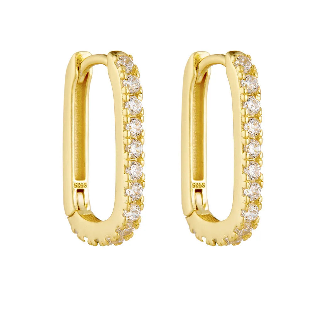 A pair of oval geometric sterling silver ear clips with zircon stones in white or yellow colour.