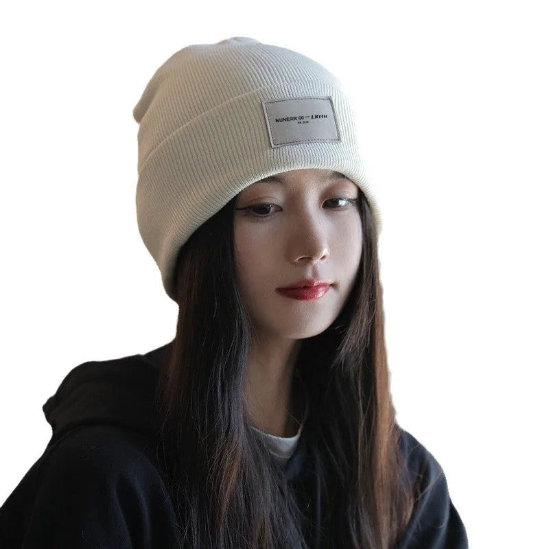 Women's knitted hat in beige, dome crown style, polyester fabric, free size, winter autumn accessory