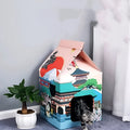 Foldable corrugated paper cat scratching board in Nagoya colour design, shown flat and folded.