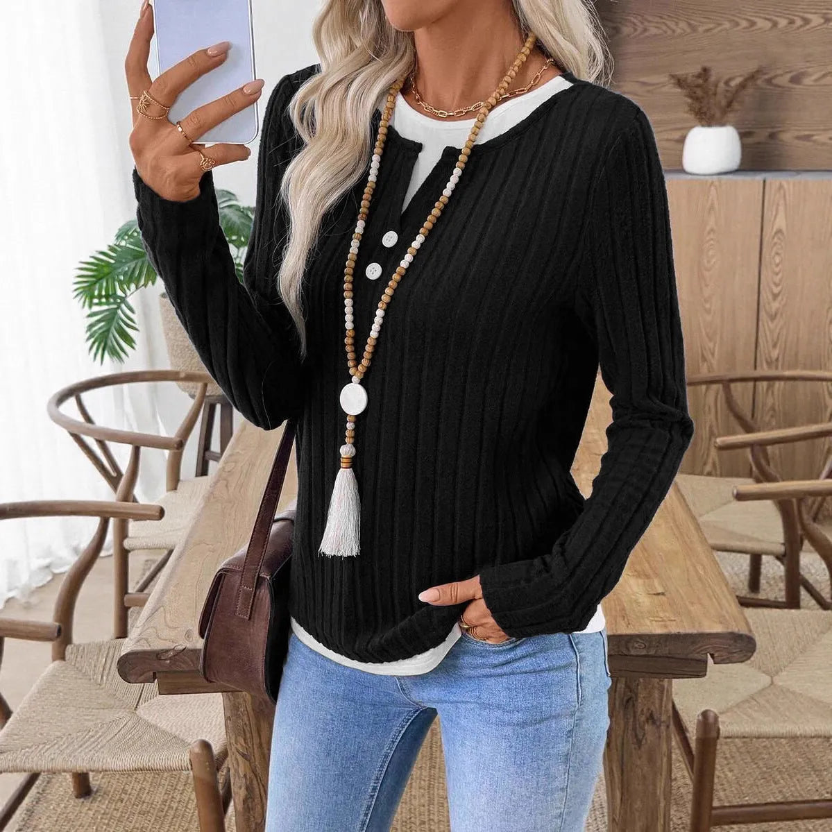 Women's solid colour button-front pullover sweater with a concave stripe texture pattern.