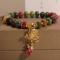 Colourful bead bracelet with alloy butterfly charm for women showing adjustable length