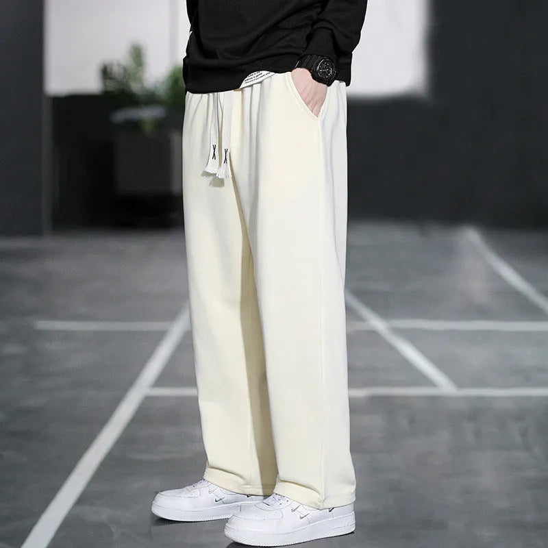 Men's grey Ninth Sports Pants showing high waist and multiple pockets.
