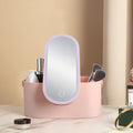 Pink portable LED makeup mirror case open, showing internal storage compartments and mirror.