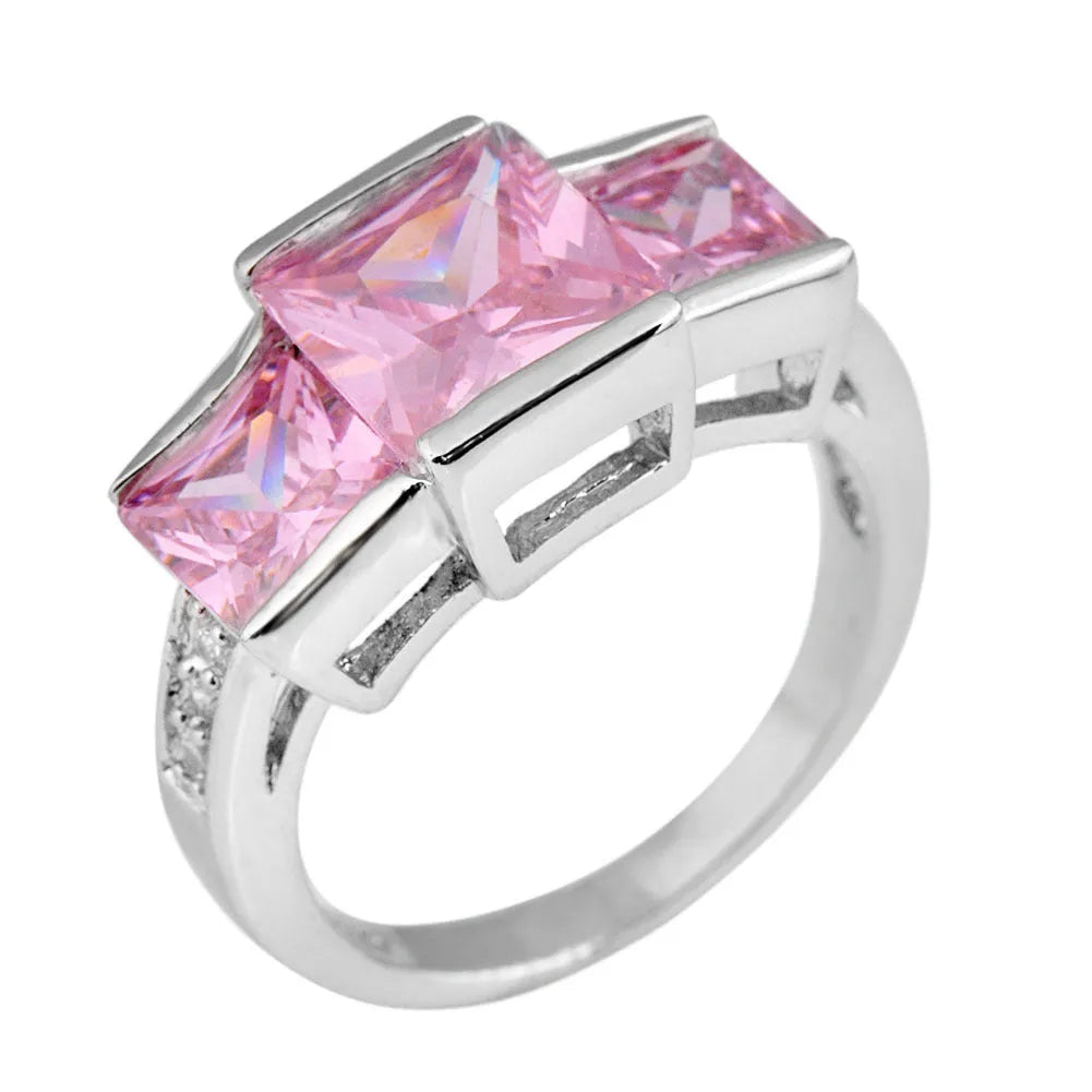 Colourful electroplated copper geometric ring on a white background, showing the metallic finish.