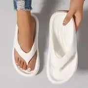 Women's thick-soled flip-flops in black, white and grey colours with non-slip EVA construction