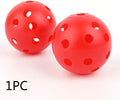 Multi-colour golf practice balls with 26-hole design on green grass, showing red, blue, green, yellow, orange, and white variants.