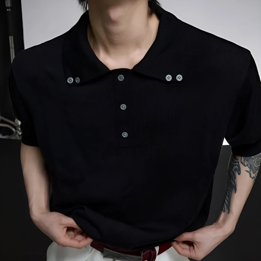 Black loose fit men's short sleeve shirt with a lapel collar and fastener decoration.