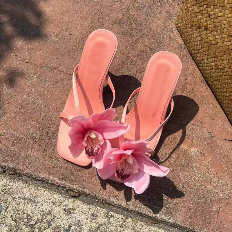 Pink women's sandals with satin uppers, artificial Phalaenopsis orchid decoration, and 3-6cm mid heel