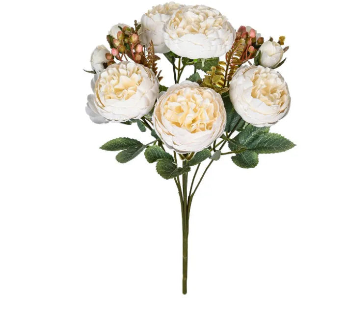 Artificial silk peony bouquet in a vase, showcasing weighted stems and champagne-coloured blooms.