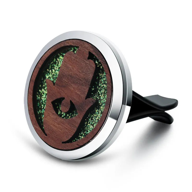 Round car vent aromatherapy clip in alloy wood construction showing hollow centre for incense