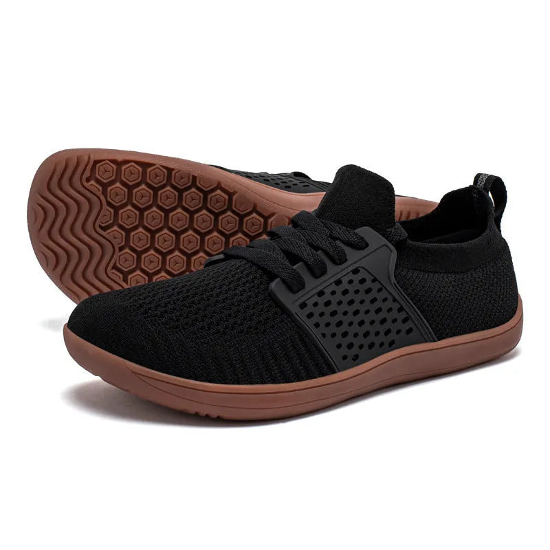 Men's lace-up casual walking shoes with a soft sole and wide toe box design in synthetic leather and mesh.