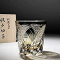 Amber gray crystal glass wine glass with rainbow effect on table, single retro cup
