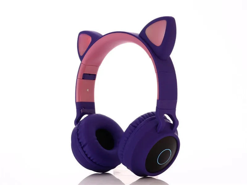 Cartoon cat ears wireless Bluetooth gaming headset shown in one of five colours: green, light blue, pink, purple, or skin tone.