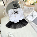 White yarn-trimmed polyester gauze skirt for a small dog on a mannequin, showing princess style.