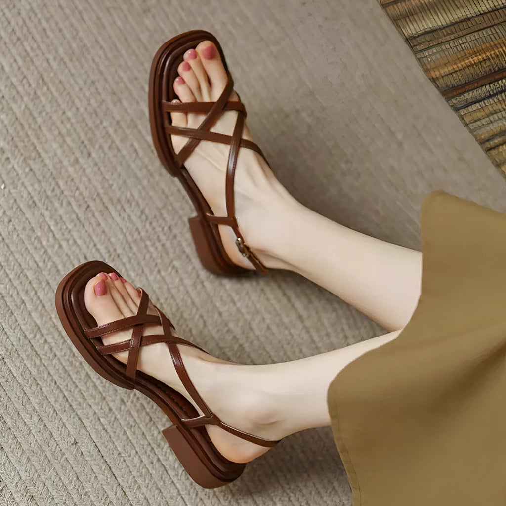 Women's cross strap buckle sandals with square toe, open toe, flat rubber sole, in milky white, black, or brown