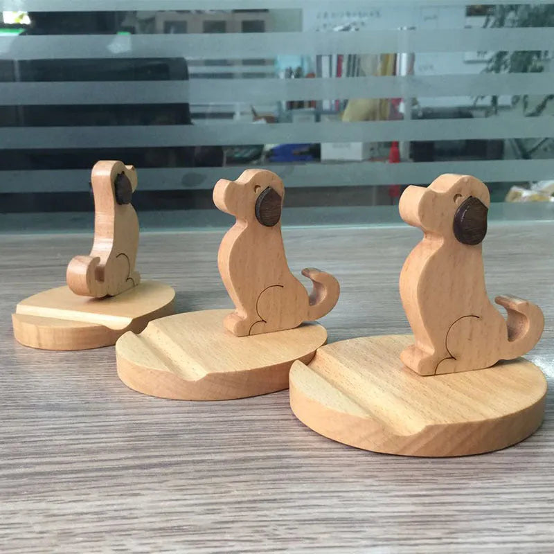 Brown solid wood desktop phone holder shaped like a cartoon puppy with spray paint finish