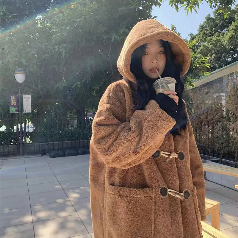Women's mid-length lamb wool coat in apricot with horn button front closure