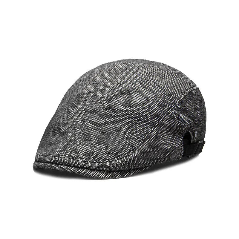 Men's cotton linen blend beret hat in black on a model, showing dome crown style.