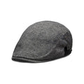 Men's cotton linen blend beret hat in black on a model, showing dome crown style.