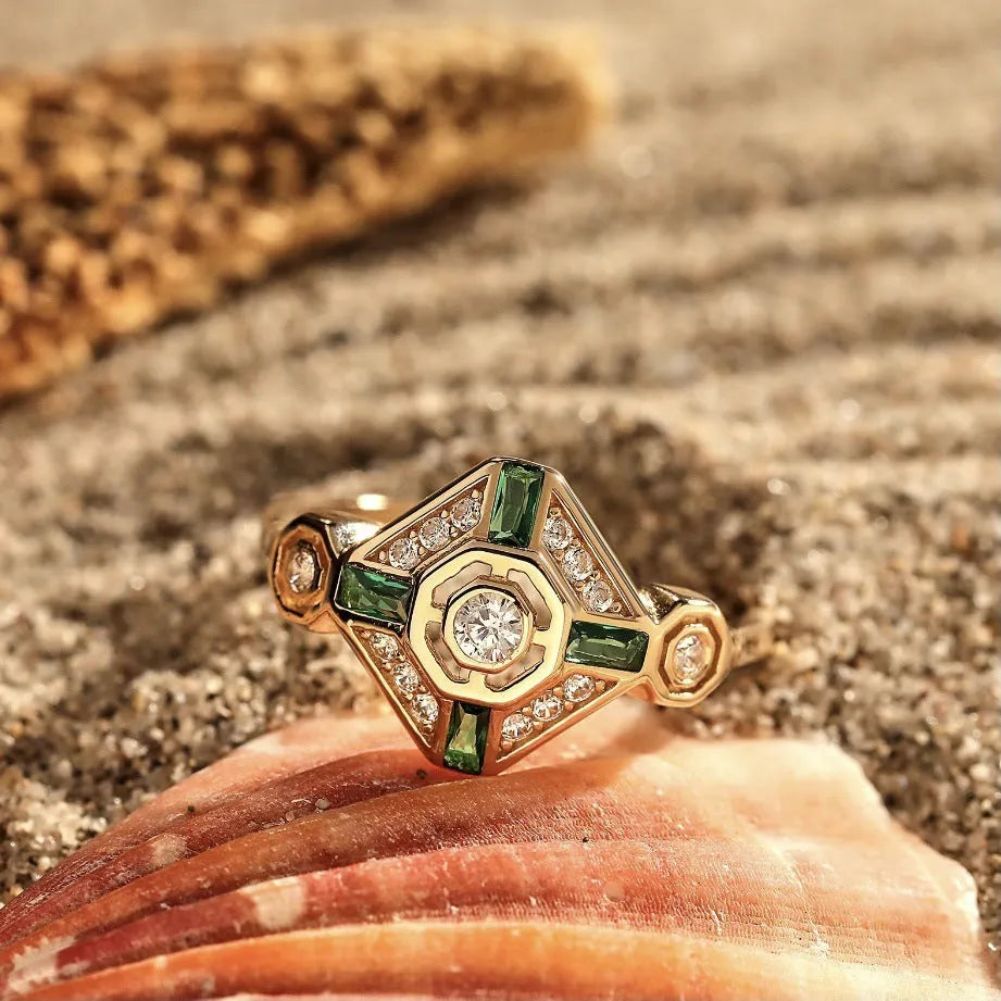 Square geometric ins-style women's ring with lvzuan coloured stones on a model's hand.
