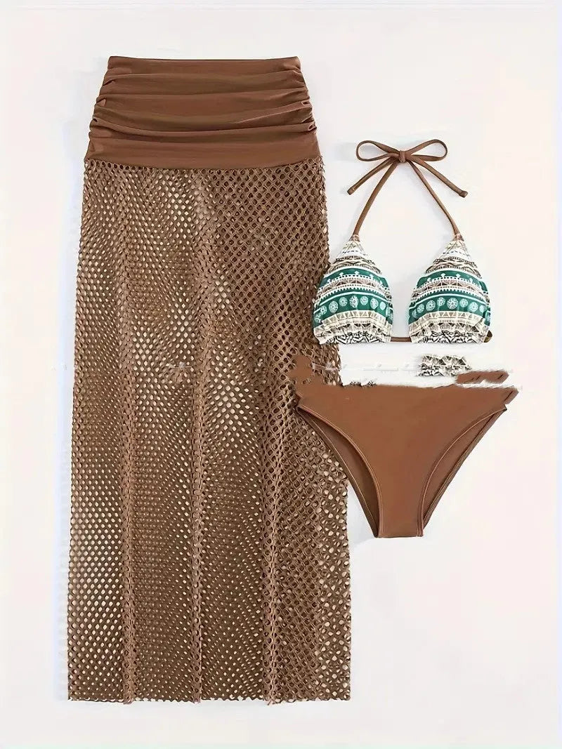 Women's brown gradient three-piece bikini set with fishnet long skirt laid flat.