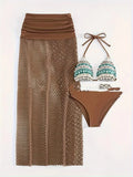 Women's brown gradient three-piece bikini set with fishnet long skirt laid flat.