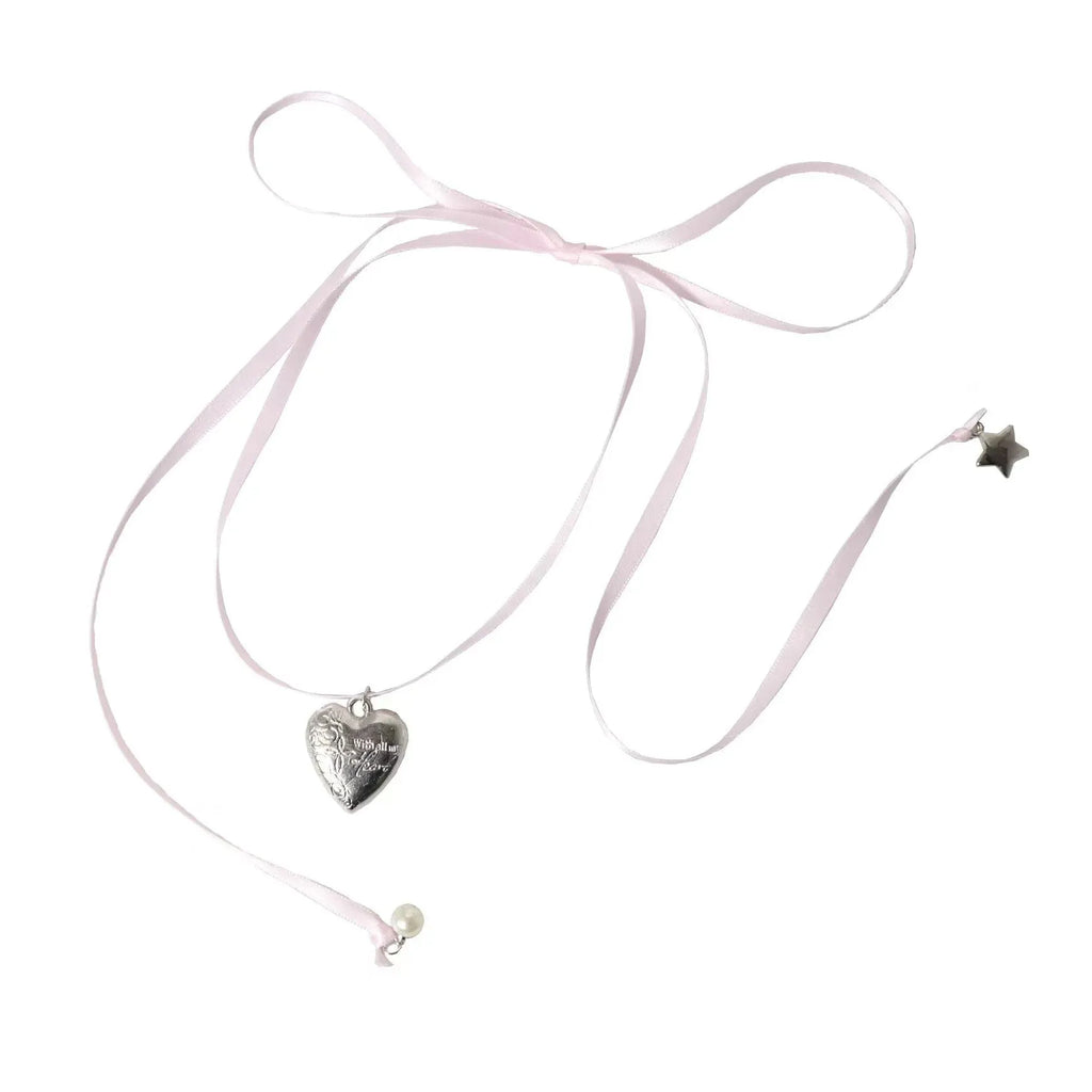 Women's ribbon love pendant necklace on a clavicle chain in an electroplated alloy, shown in one of 33 colour options.