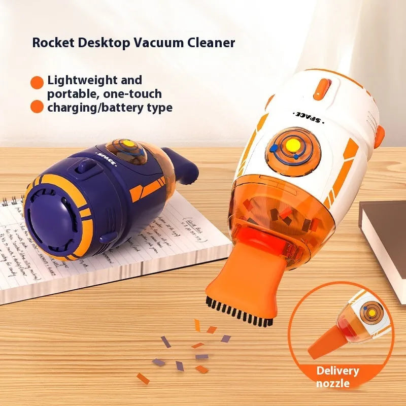 Blue rocket-shaped USB rechargeable handheld desktop vacuum cleaner on a wooden desk next to a keyboard