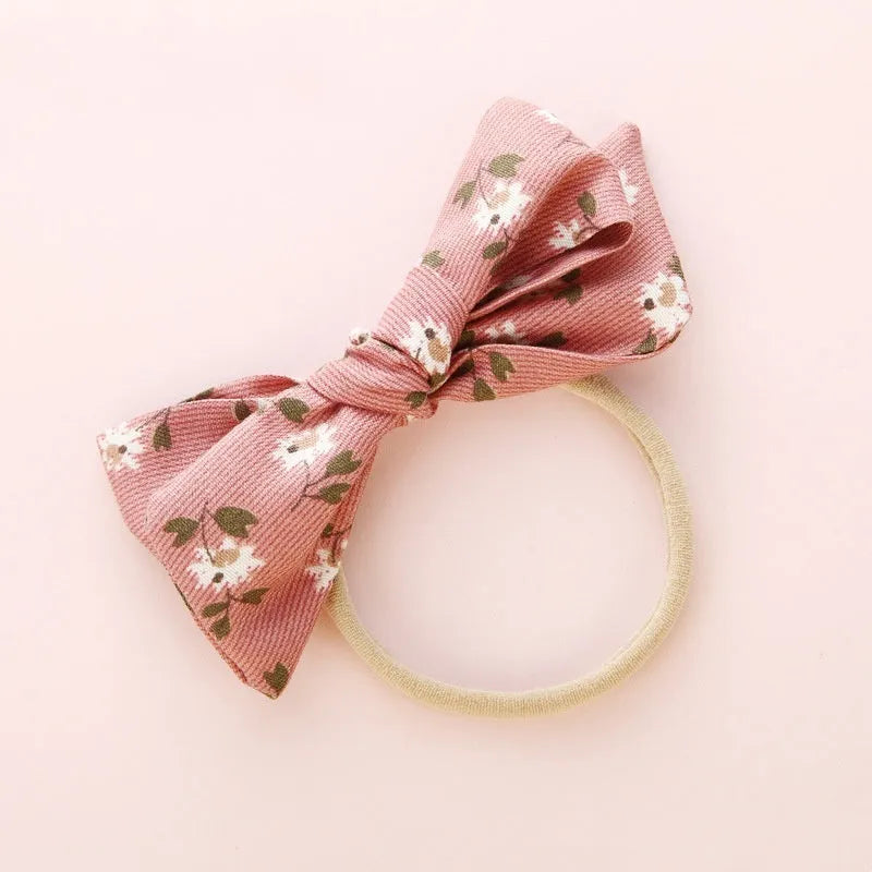 Children's cloth knotted bow hair ring in a Snow White princess design.