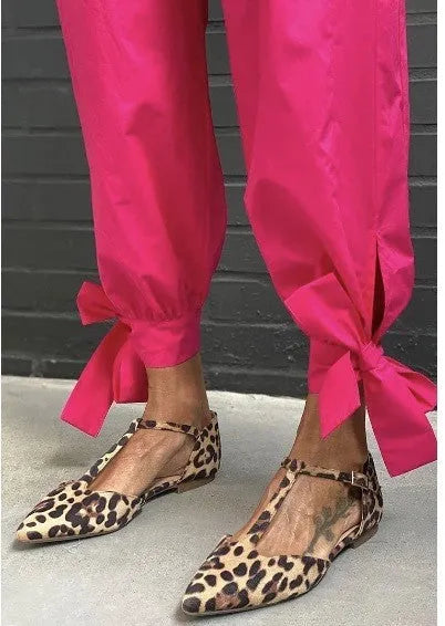 Leopard print women's pumps with pointed toe, chunky low heel and cross shoulder strap