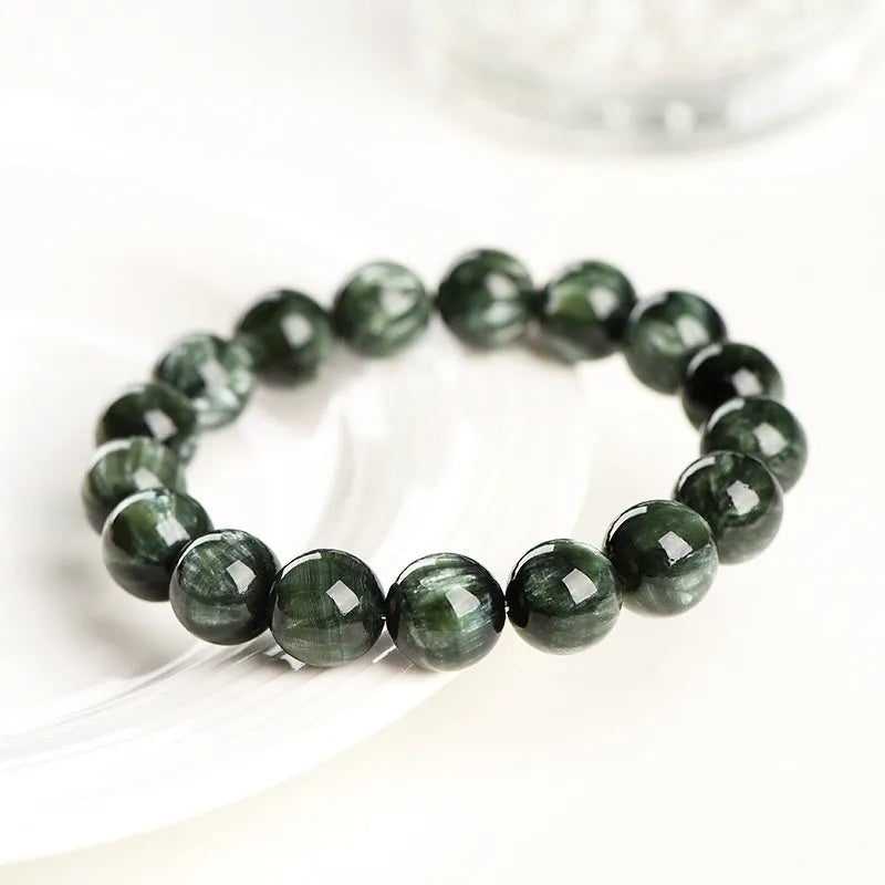 Green Dragon Crystal bracelet with 8-9mm round beads on a white background.