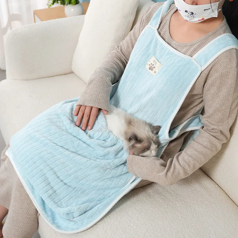 Cloth cat petting apron in a striped pattern, shown worn by a person holding a cat.