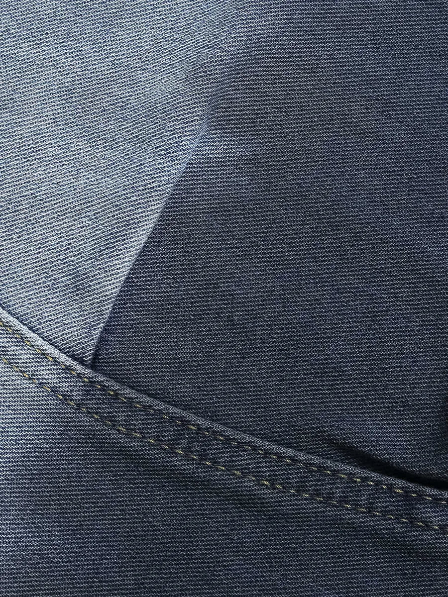 Blue tie-dye gradient cropped jeans with loose fit and worn wash on a mid-waist