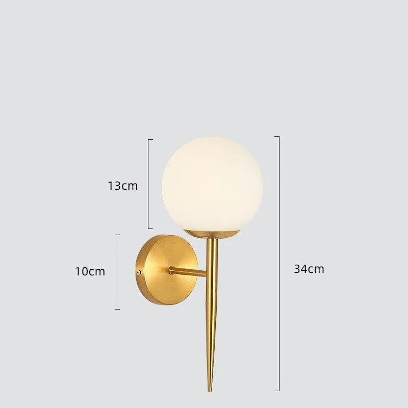Modern copper coloured wall lamp with glass lampshade for bedroom or hallway lighting