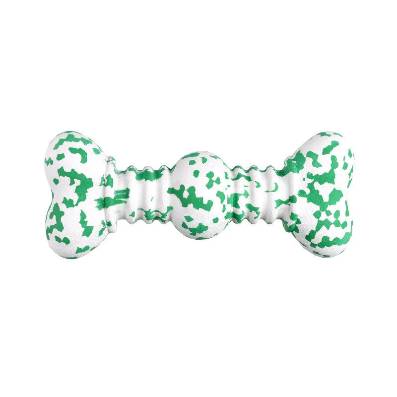 Green and white camouflage patterned natural rubber dog chew toy for large breeds on a wooden floor.