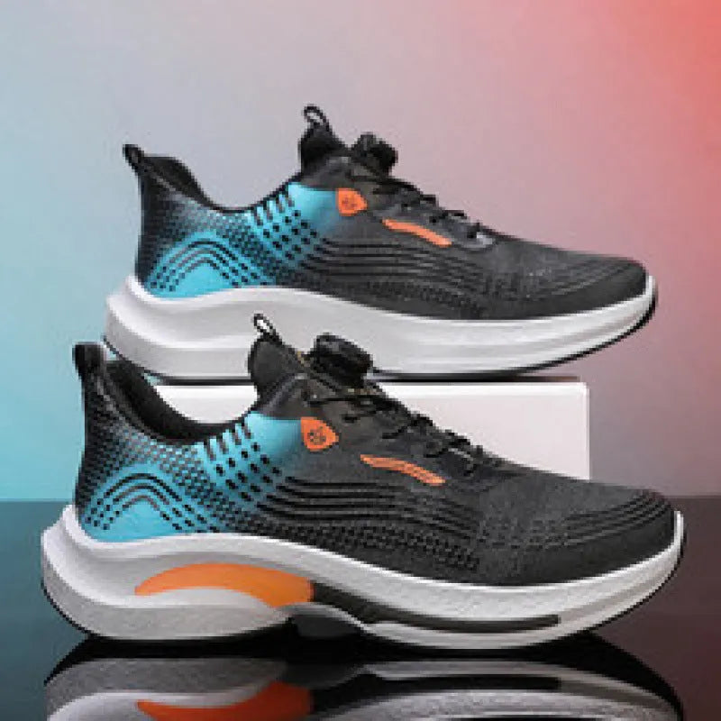 Men's low-top sneaker in white and orange colourway, showing mesh texture and rubber sole.
