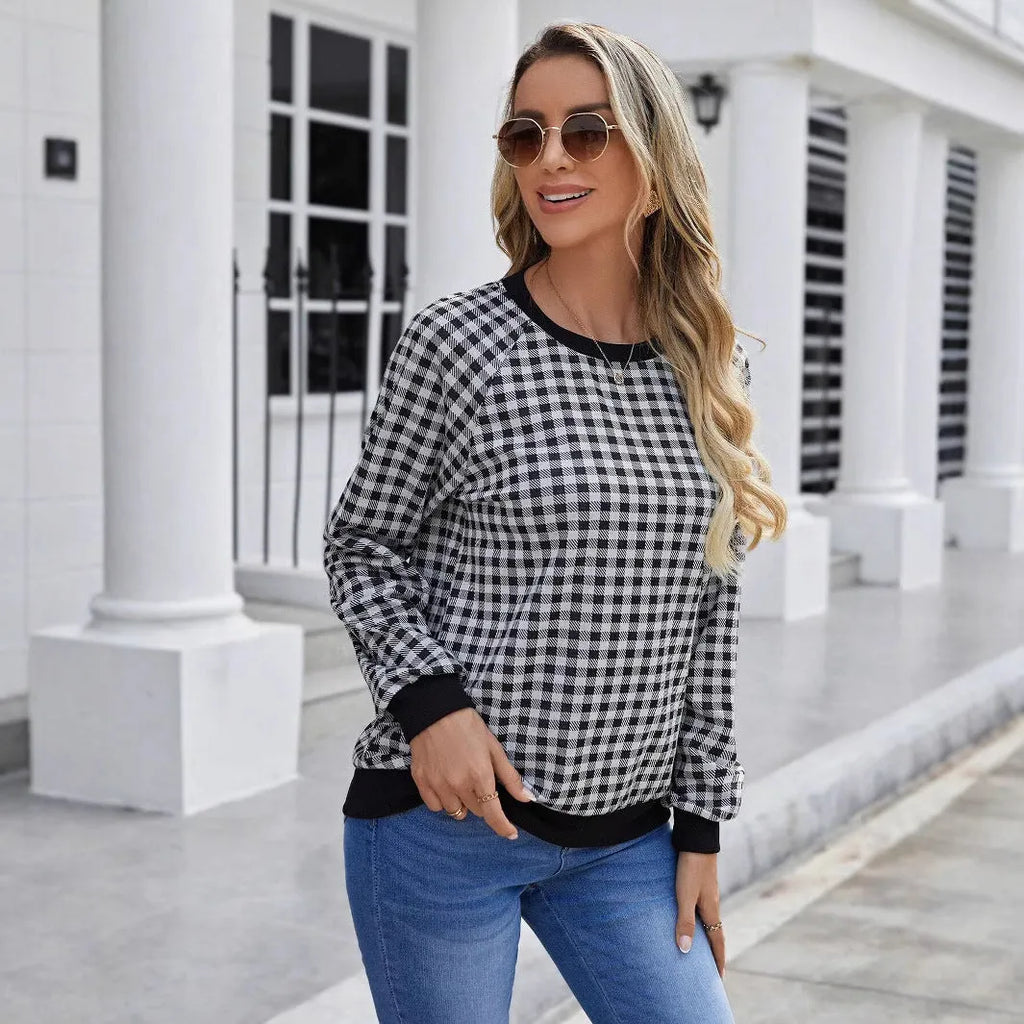 Black plaid stripe long sleeve pullover sweater laid flat, showing Japanese style pattern.