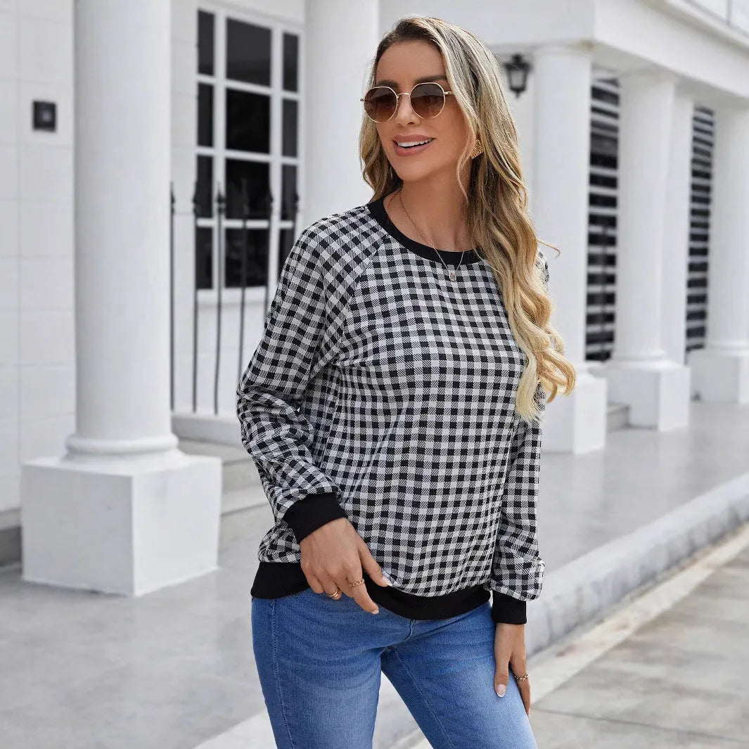 Black plaid stripe long sleeve pullover sweater laid flat, showing Japanese style pattern.