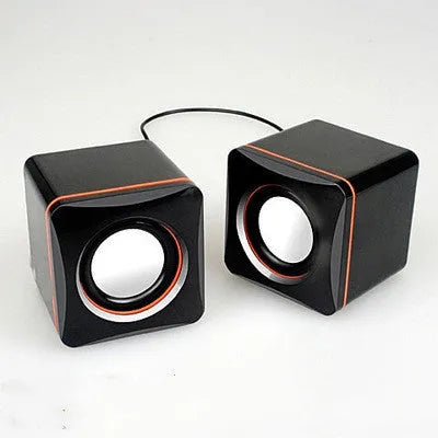 Black, small square USB-powered 2.0 computer speaker for desktop use.