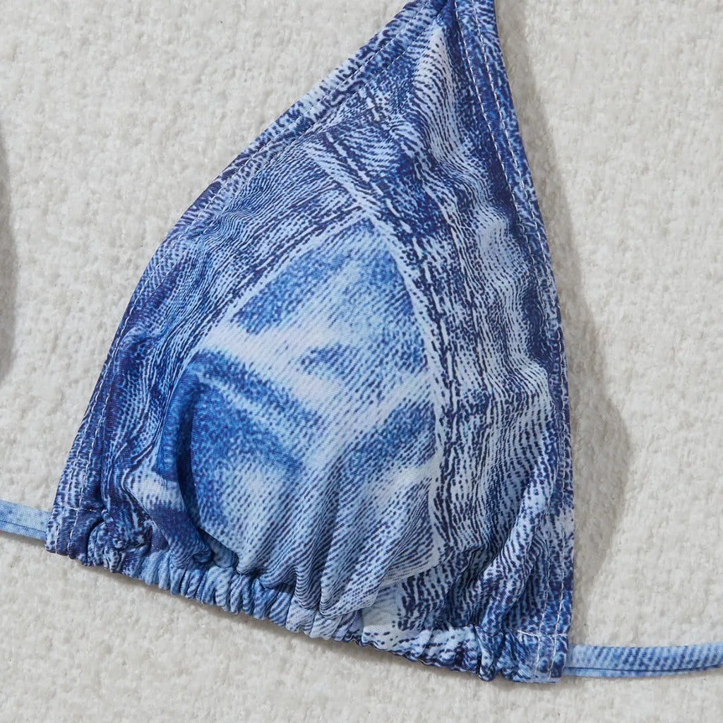 Denim blue printed women's bikini set with strap detail on a mannequin