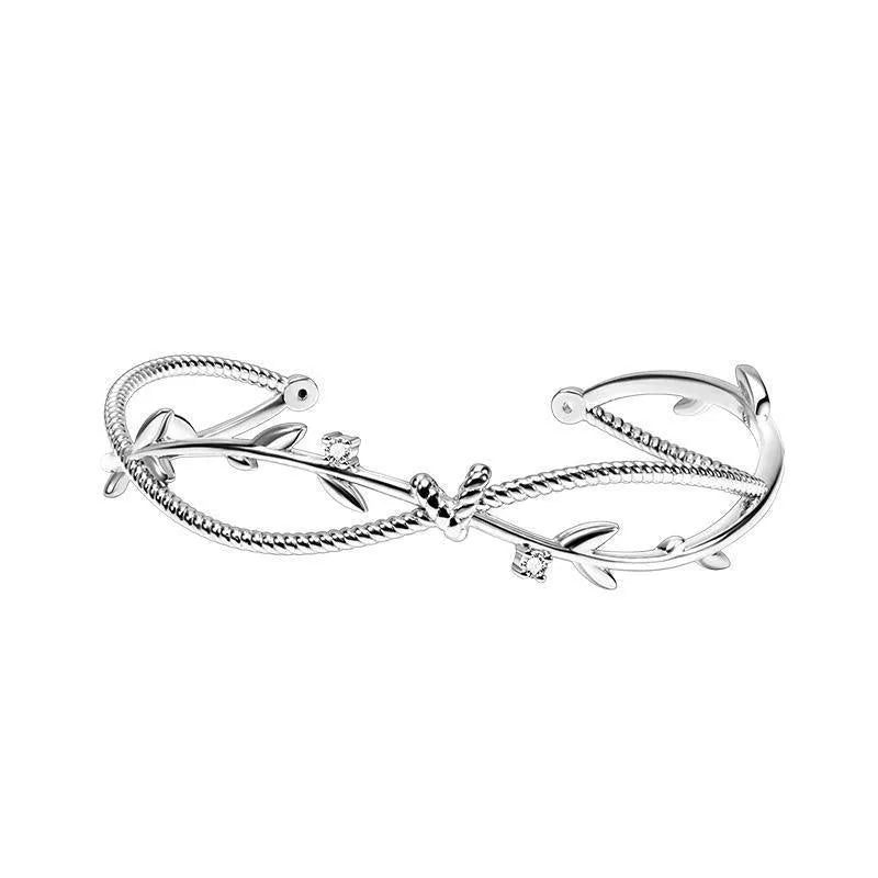 Cross twisted design branch sprout bracelet with white gold electroplated finish on copper