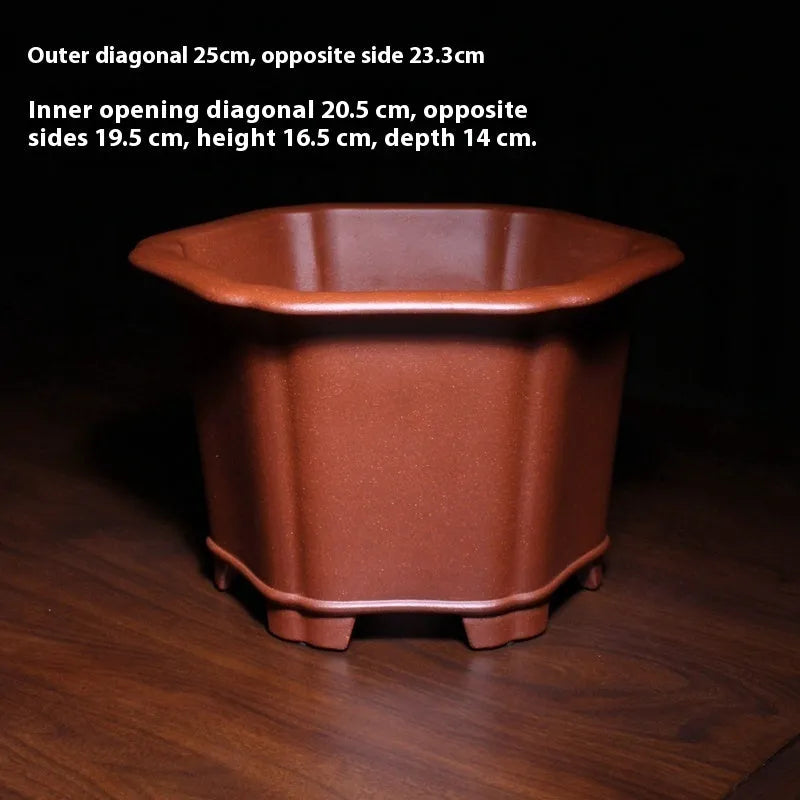 Square blue descending slope mud Zisha ceramic flowerpot on desktop with a plant