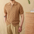 Man wearing a light brown zip-front cotton cardigan with short sleeves and a lapel collar.