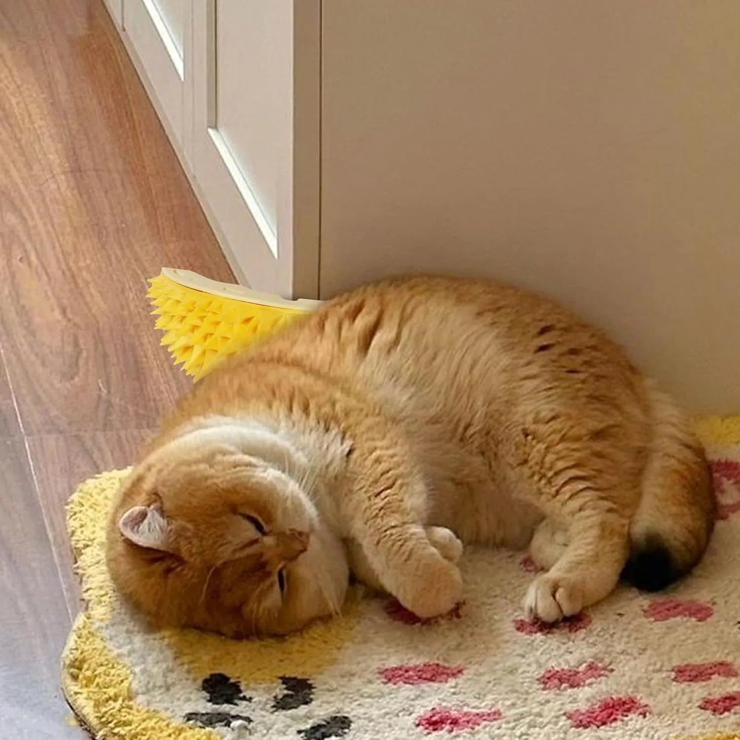 Yellow durian-shaped cat corner scratcher with textured surface and included mint powder packet